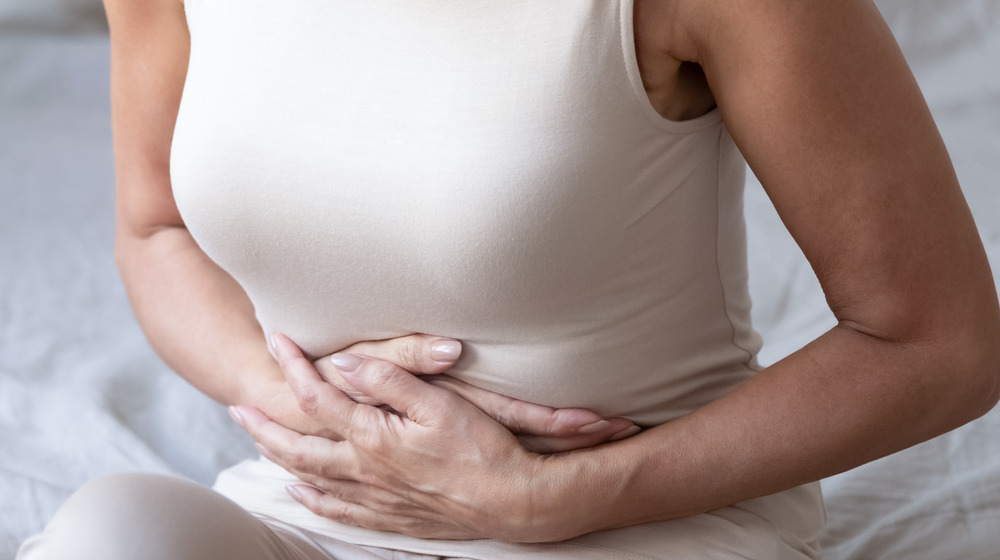 woman holding her stomach