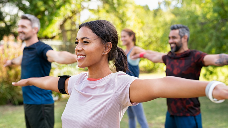 fitness class stretching outside