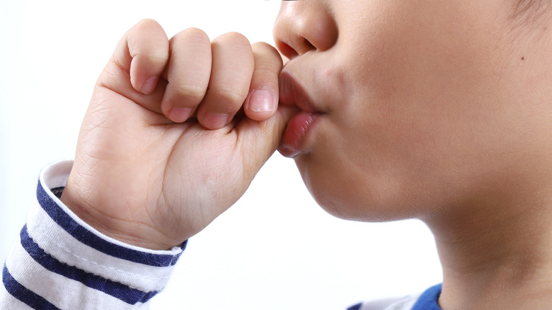 Baby girl sucking finger