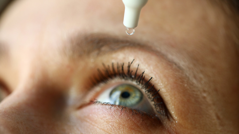 close-up of eye drop being put into eye