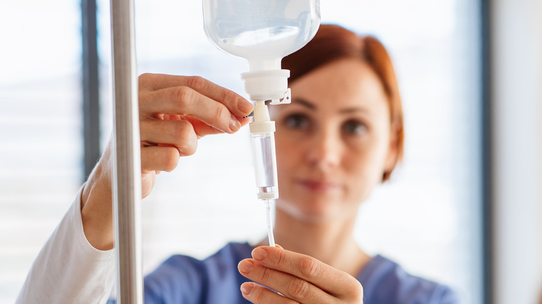 Nurse preparing IV drip