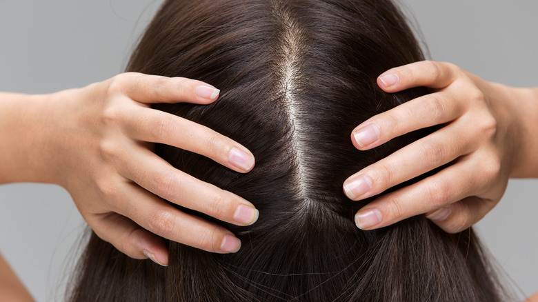 Woman showing part in her hair without dandruff