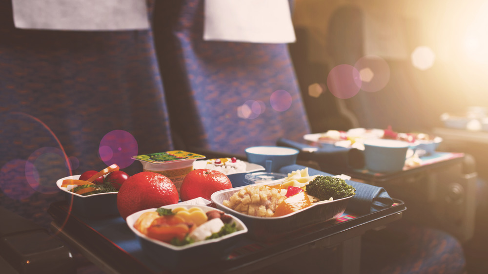 trays of food on a plane 