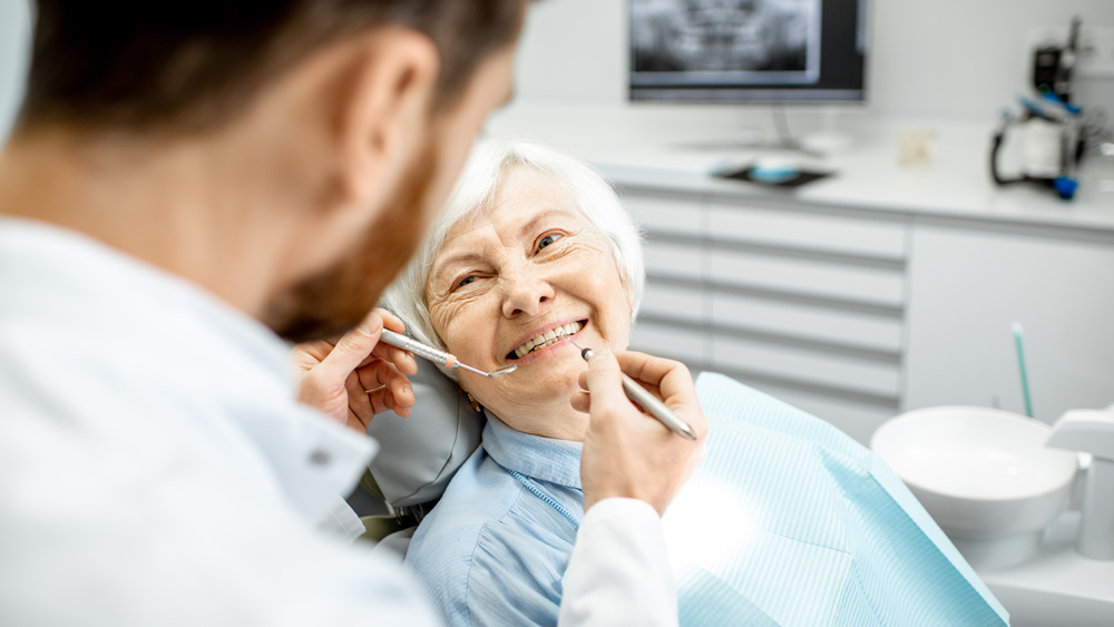 Smiling older woman in a dentist's chair