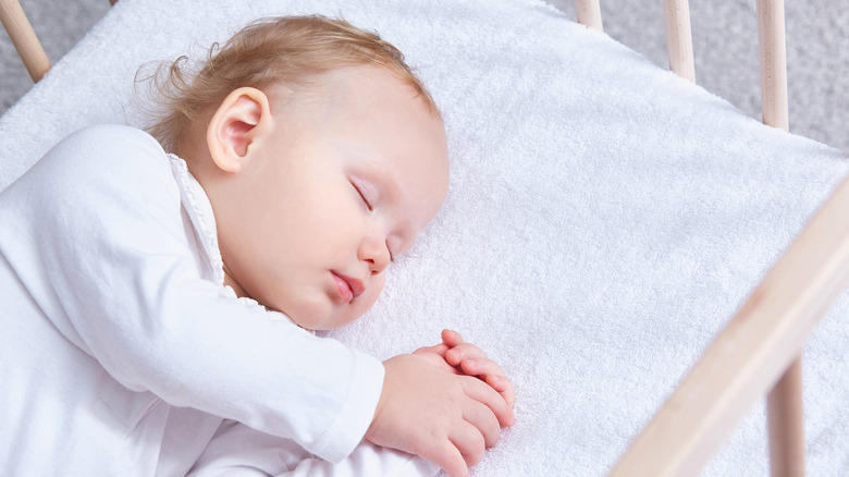 baby sleeping in crib