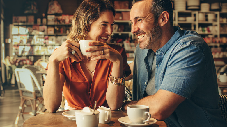 couple having coffee at coffee shop