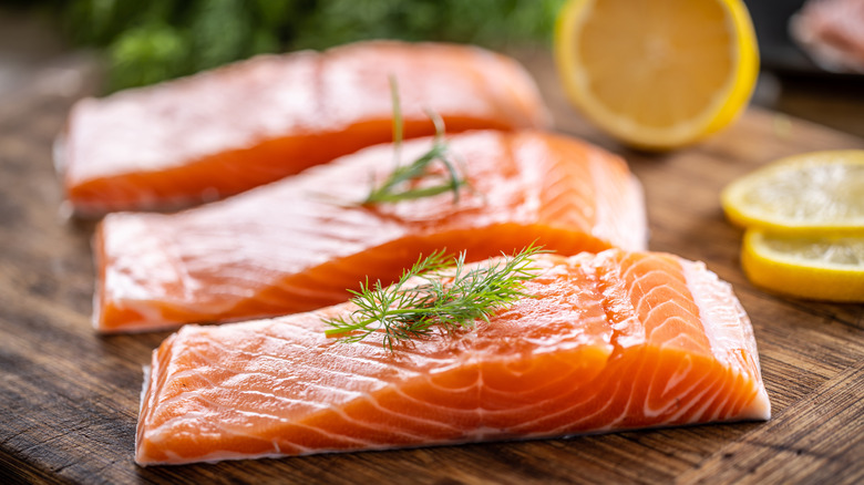 salmon filets on a wood block