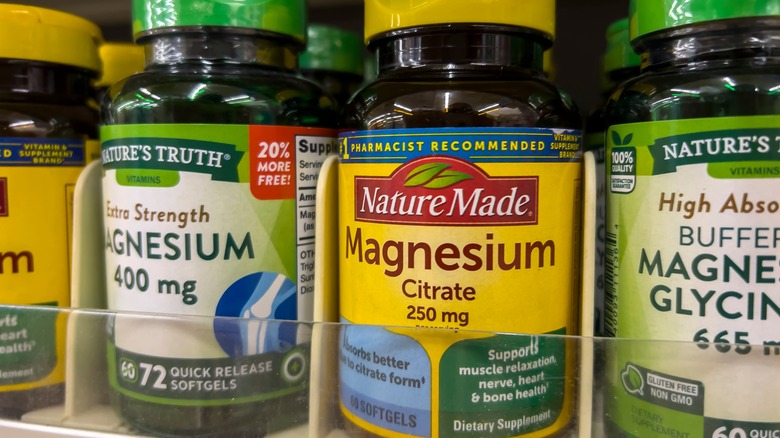 Magnesium supplement bottles on store shelf