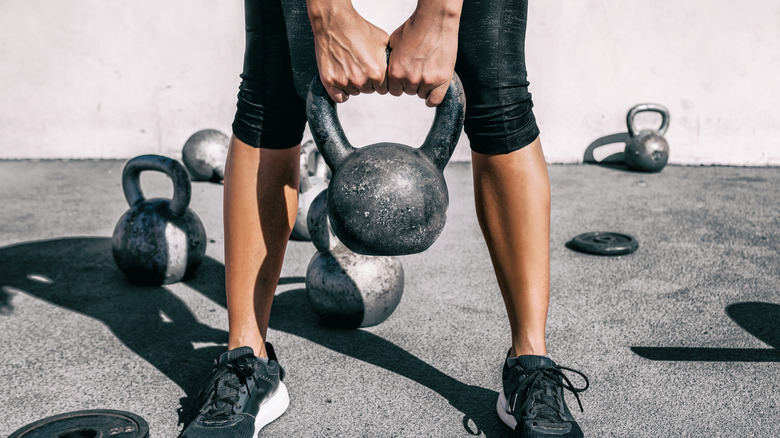 woman working out with kettlebell