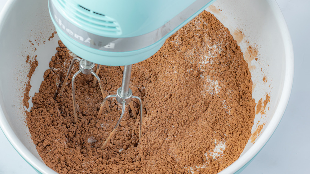 mixing dry ingredients for vegan chocolate cake