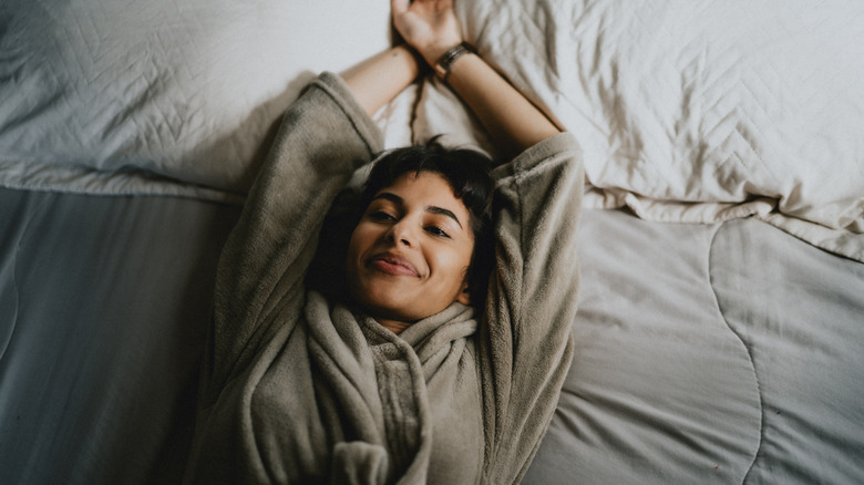 Woman relaxing in bed