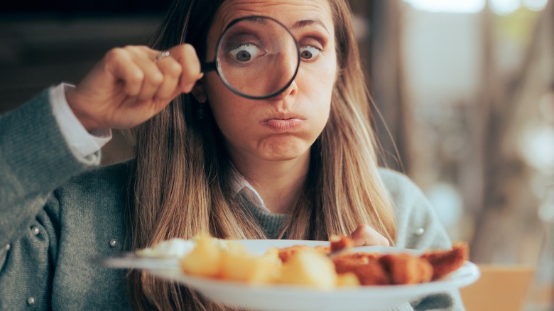 Woman looking at her food