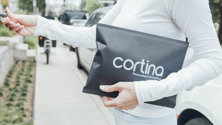 Woman carrying customized Cortina products