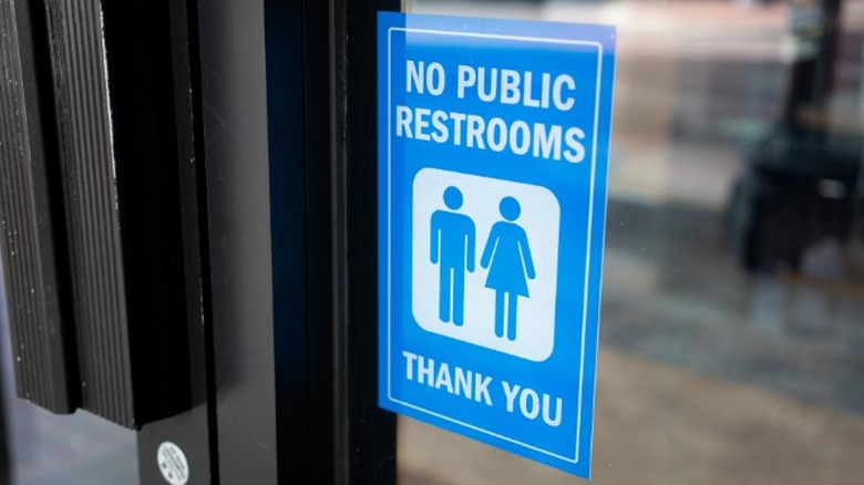 No public restroom sign in window