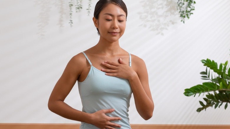 Woman practicing deep breathing