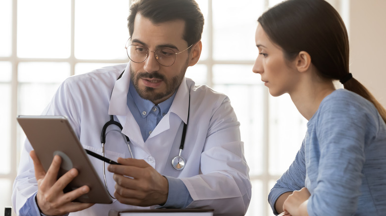 woman speaking with doctor 