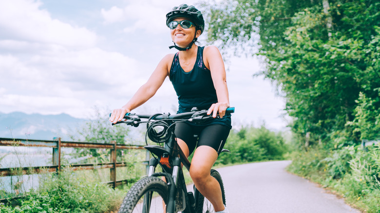 Fit woman biking outdoors