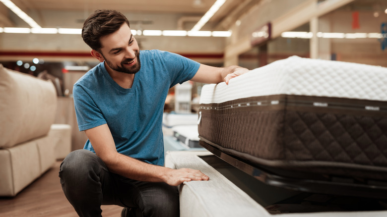 Man shopping for a new bed