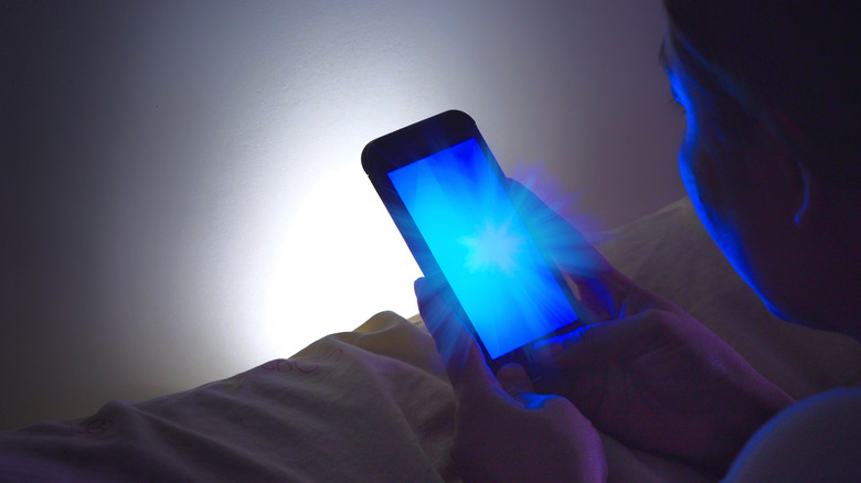 Women looking at a cellphone in low light