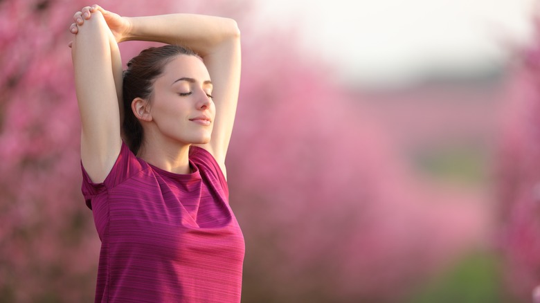 woman relaxing and stretching after running