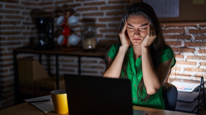 woman working dark office