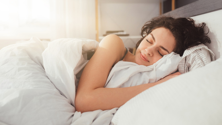 woman sleeping on bed