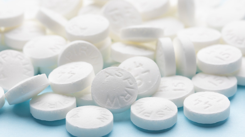aspirin pills on white surface