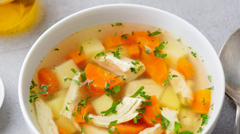 chicken soup in white bowl