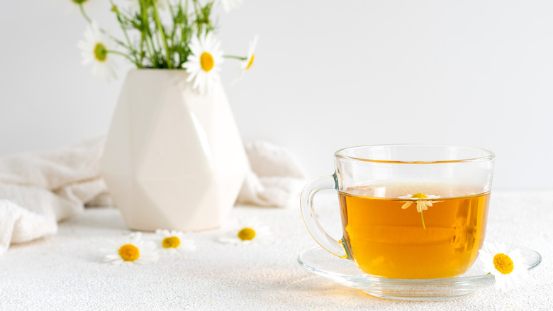 chamomile tea on white surface