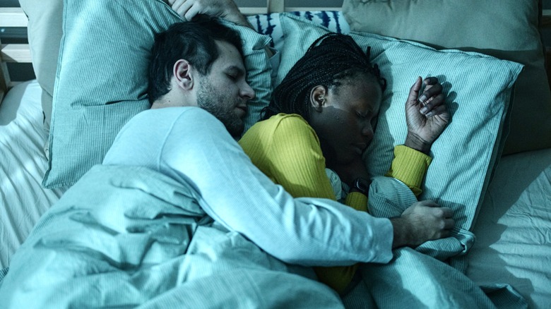 mixed race couple sleeping