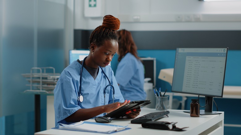 Nurse holding digital tablet