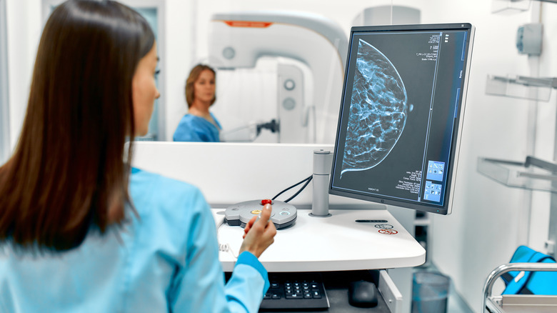 radiologist looking at mammogram image