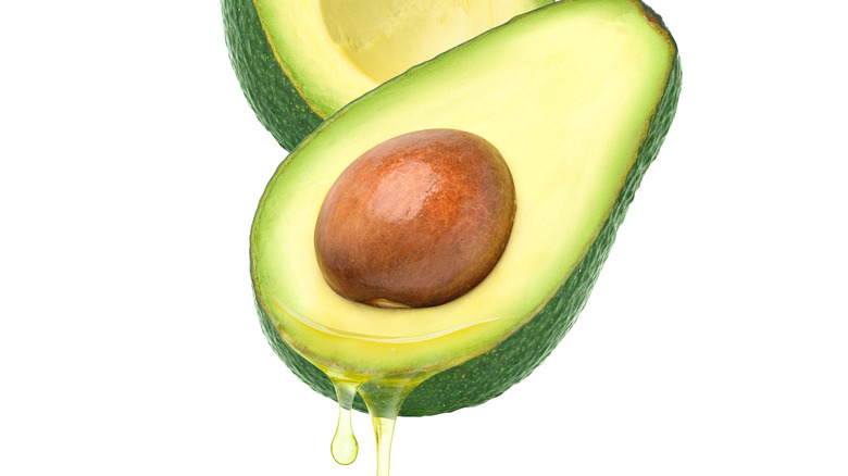 avocado dripping with oil healthy fat