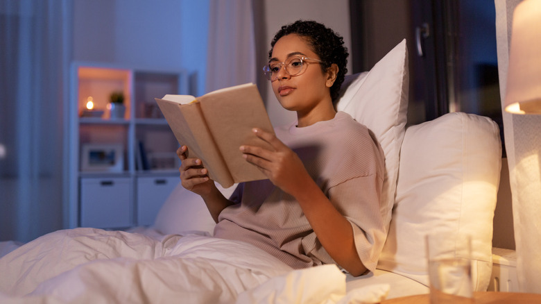 woman reading in bed