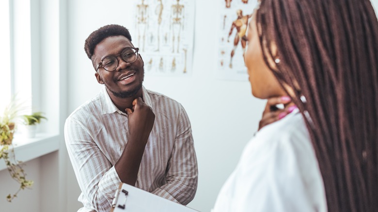 doctor describing tonsillectomy to patient