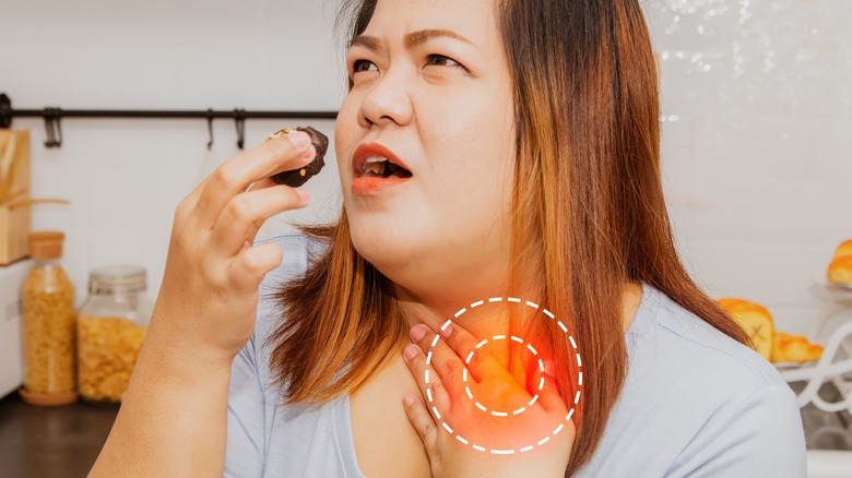 woman struggling to swallow food