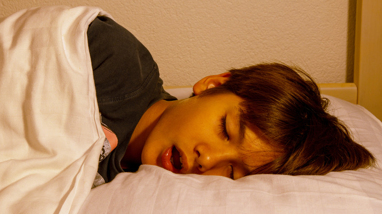boy sleeping on side open-mouthed