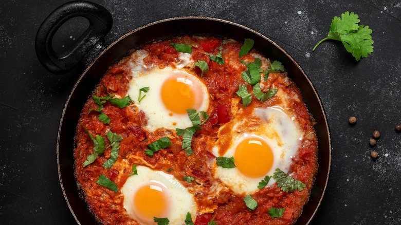 shakshuka with eggs in pot