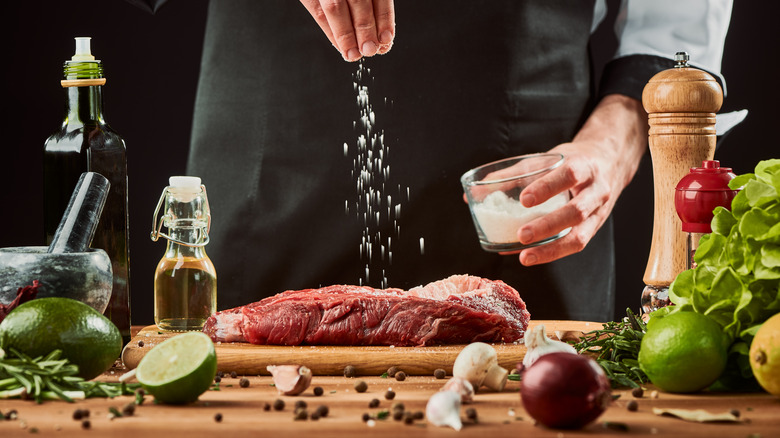 Man seasoning a steak