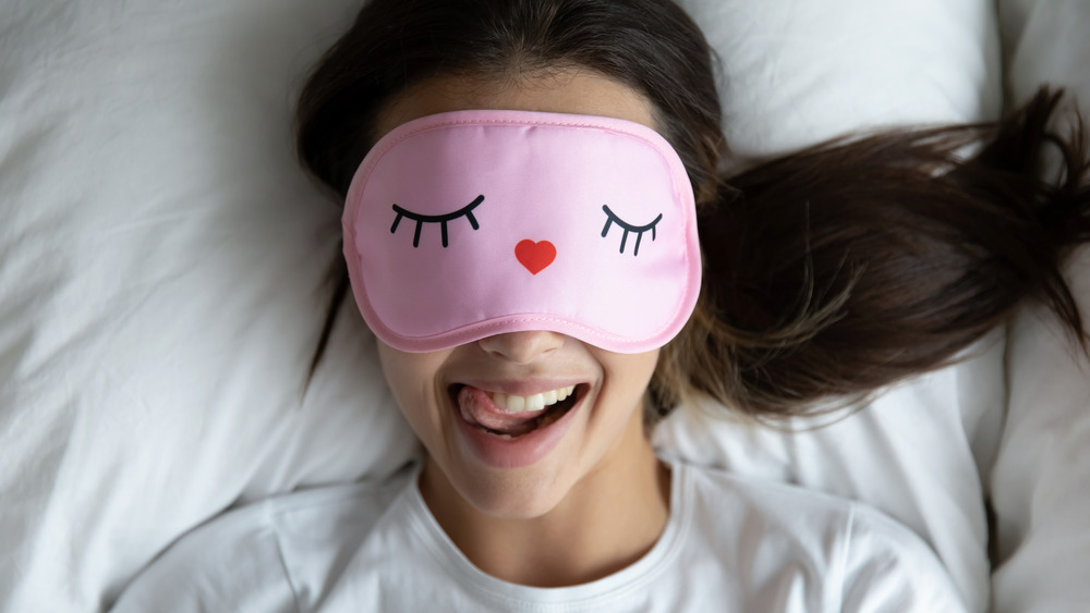 woman wearing sleep mask