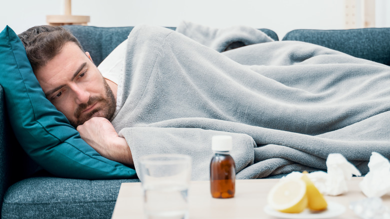 sick man on couch