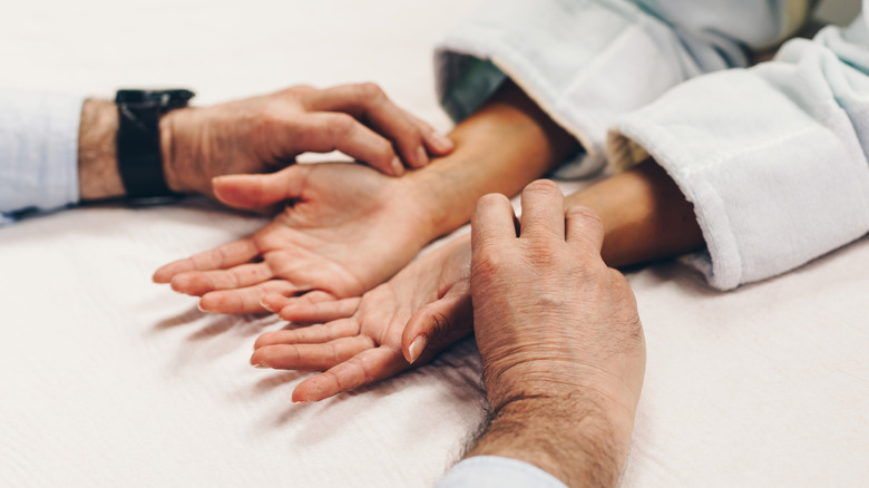 woman's hands getting acupressure therapy