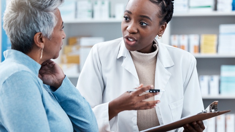 pharmacist talking with customer