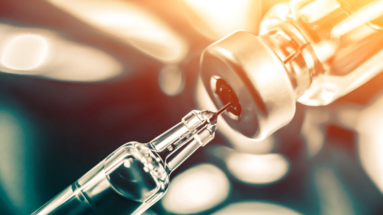 photo of a syringe and bottle