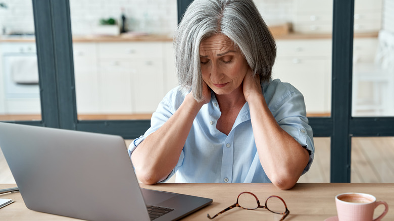 stressed older woman with computer