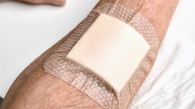 Woman's arm covered with bandage