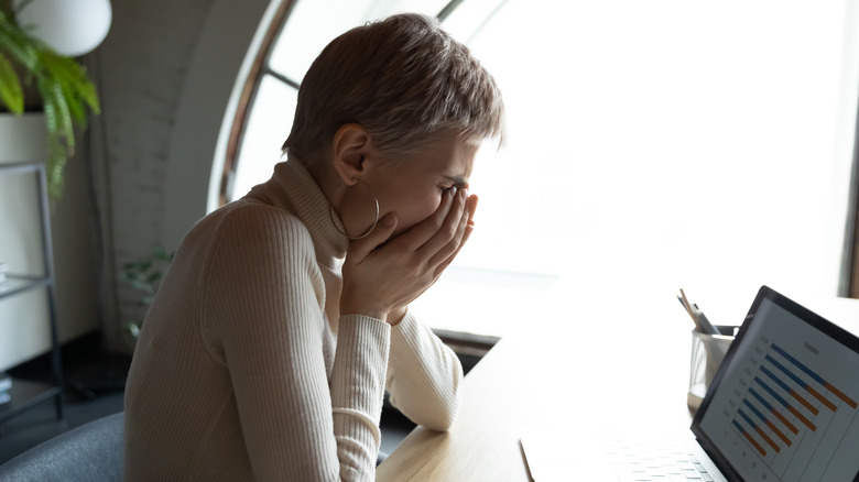 woman in agony while working