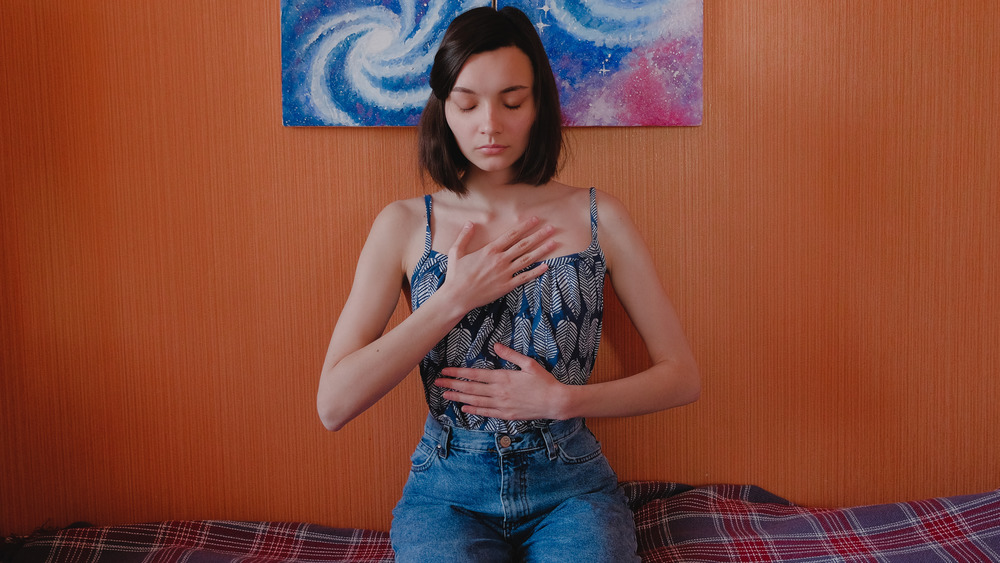 woman doing diaphragmatic breathing