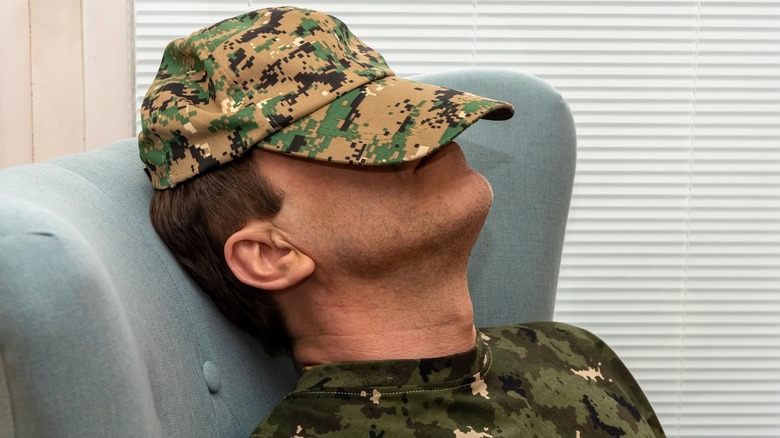 Man in military clothes sleeping