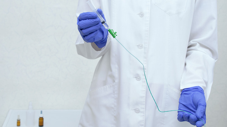 doctor holding a catheter